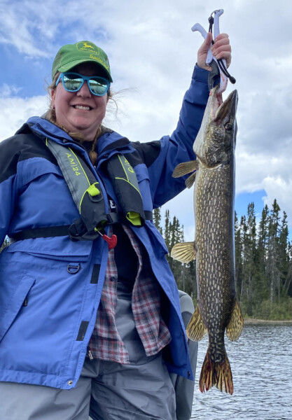 fish15 Woman holding a fish freshly caught fish at Woman Lake Lodge Canada