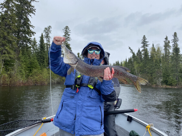 fish4 Woman holding a fish freshly caught fish at Woman Lake Lodge Canada